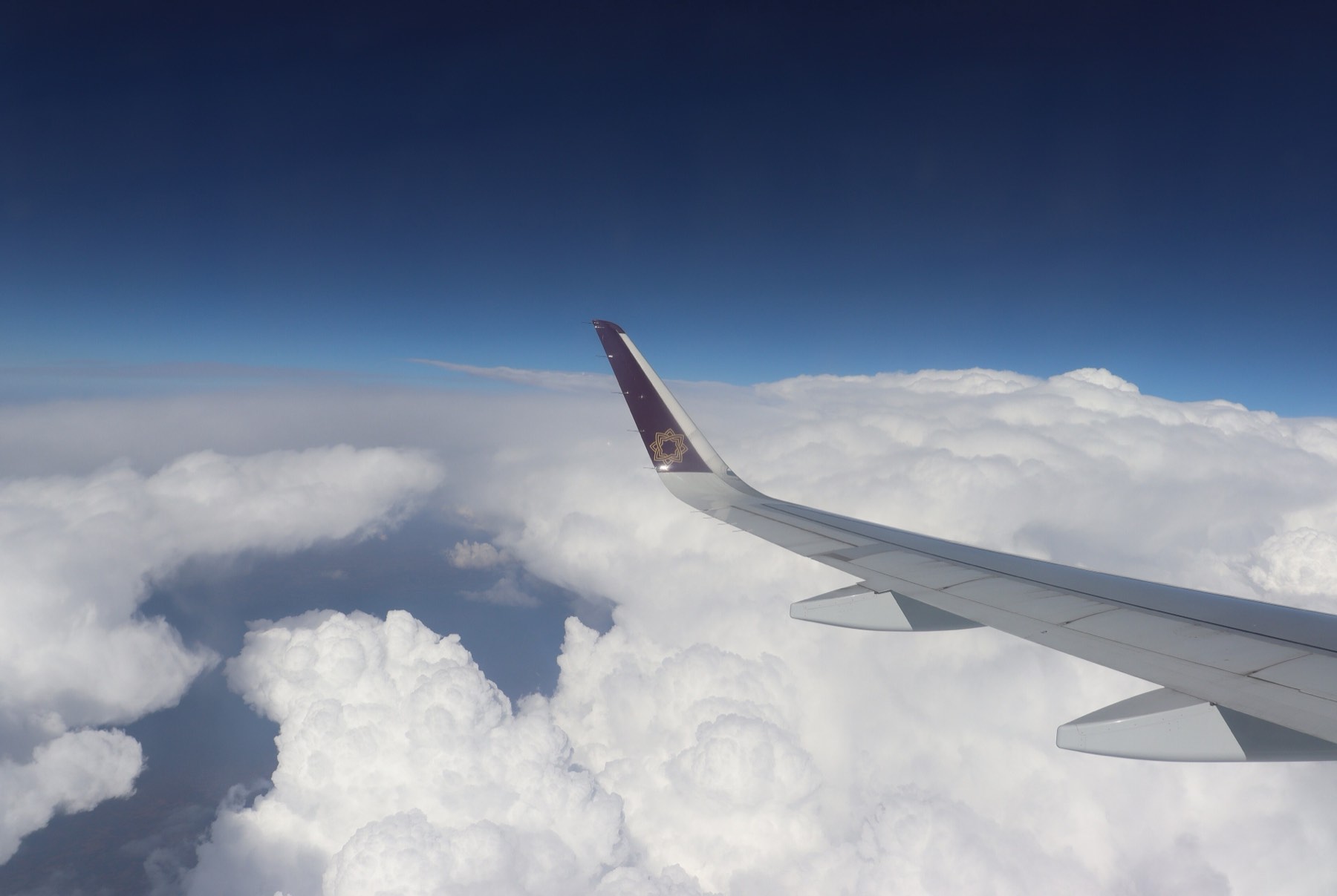 Aircraft wing above cloud